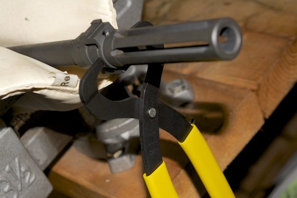 Use the castle nut pliers to loosen the nut. Looking from the breech end, the nut will turn clockwise.
