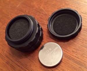 A hidden feature! The scope caps have a separate padded compartment for storage - like extra batteries.