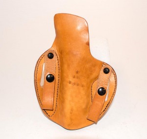 When used as an outside-the-waistband holster, the IWB straps hand out of the way on the back.