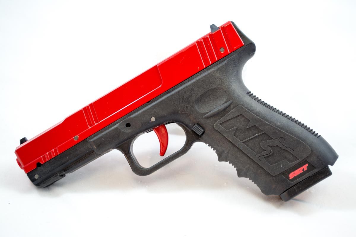 This is the Next Level Training SIRT Practice Pistol. The red slide clearly indicates that it’s not a real gun.