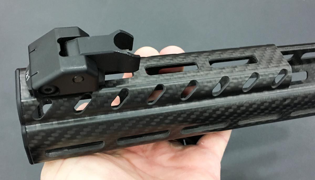 Even the top rail is M-Lock, not Picatinny, so you'll need compatible iron sights. 