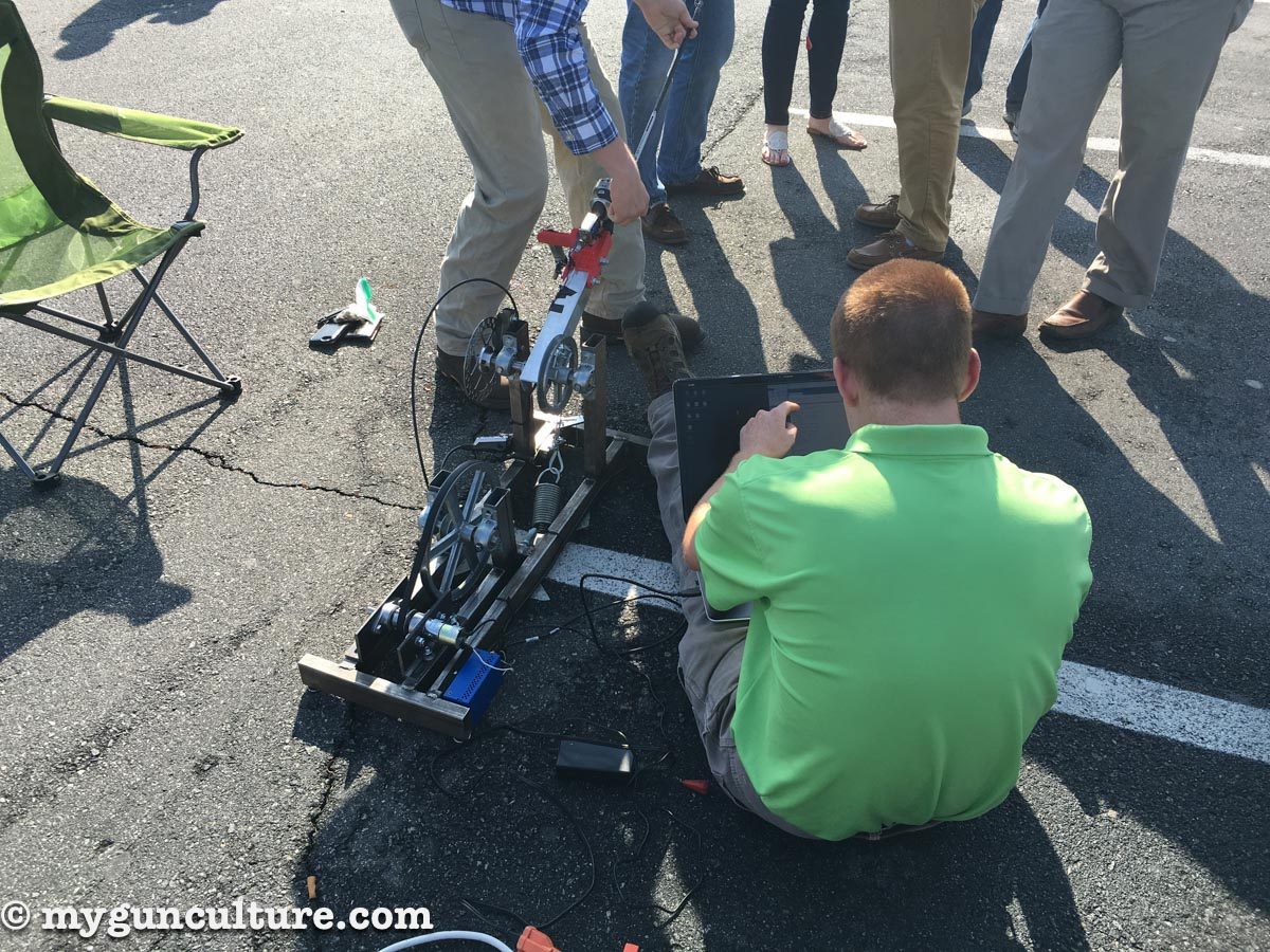 UNC Charlotte engineering students tweaking their fishing pole casting invention. 