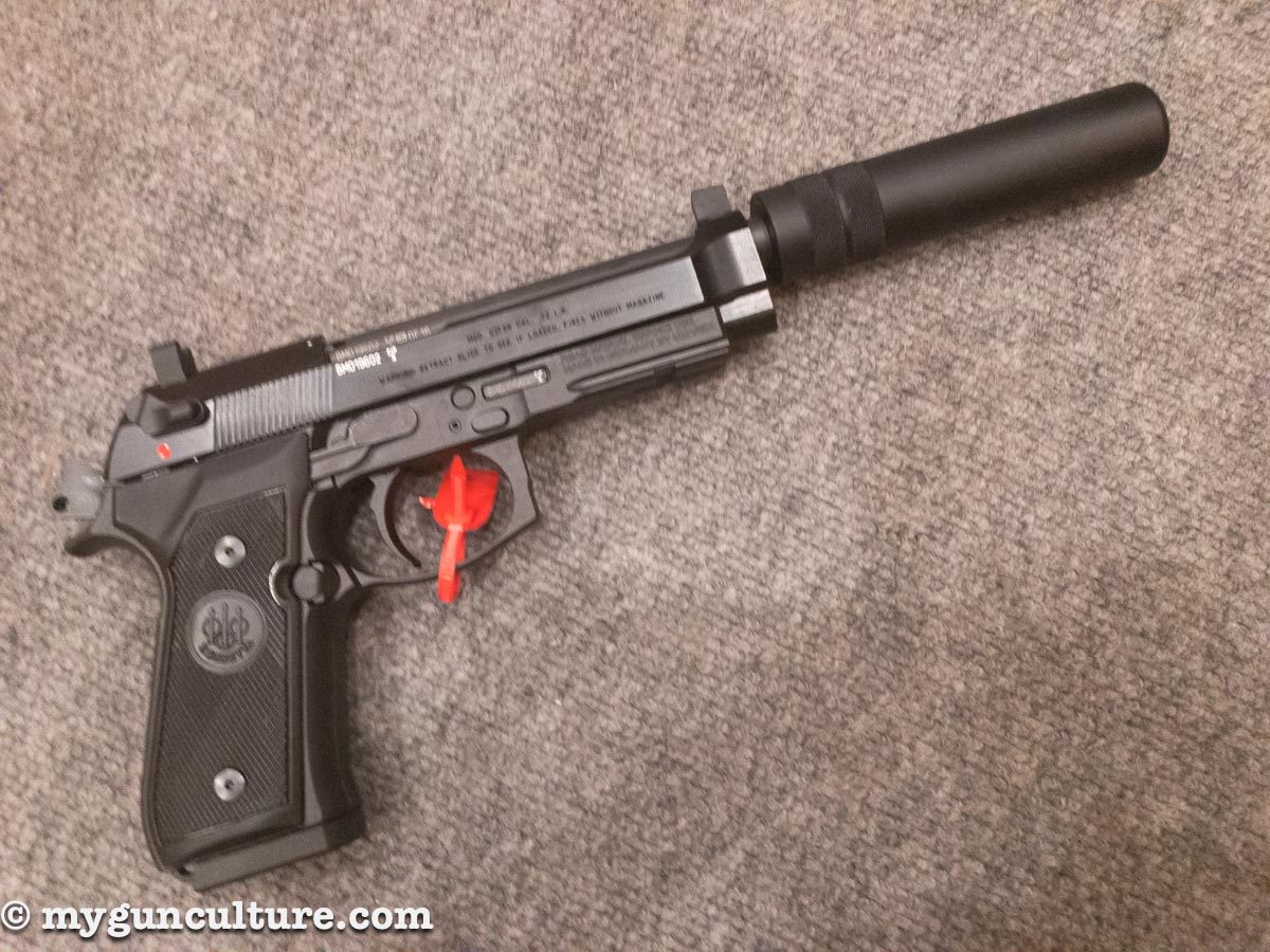 A new Beretta 92 .22LR pistol, complete with threaded barrel and a "faux" suppressor to tide you over until the tax stamp arrives for a real one.